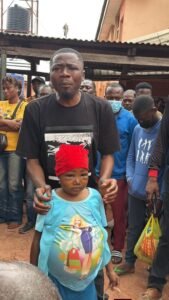 Okwuluora with a child suffering from kidney failure.