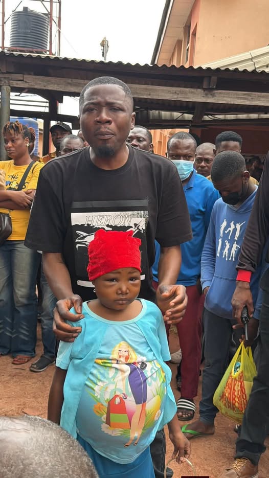 Okwuluora with a child suffering from kidney failure.